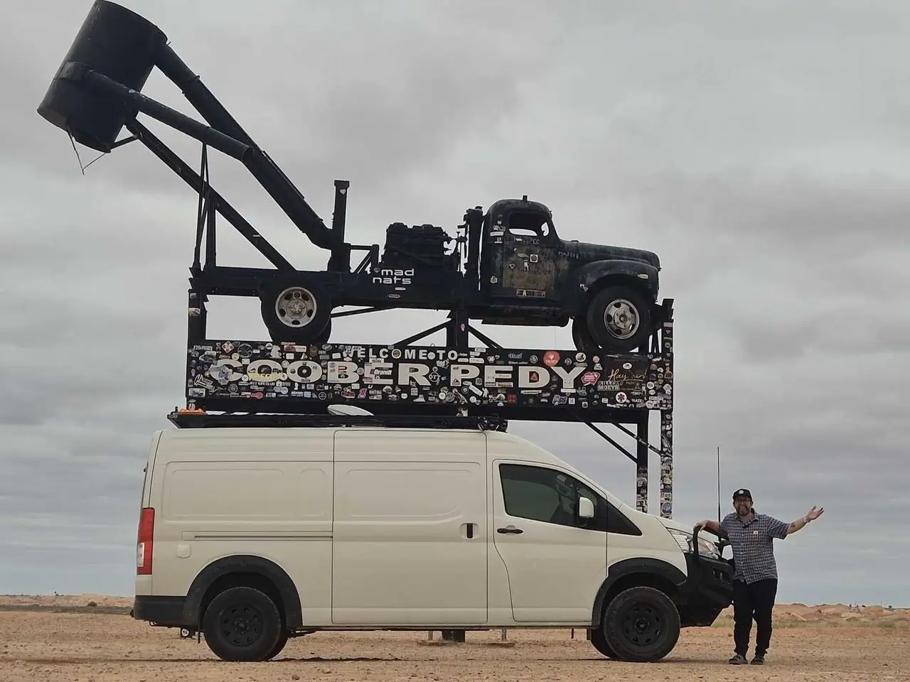 Mark and the HiAce under the Coober Pedy truck sign.